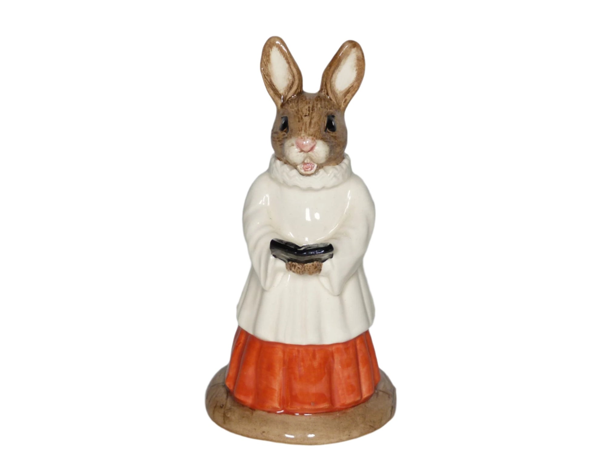 The bunny is wearing a white surplus with a frilled collar and a red robe, standing holding a hymn book.