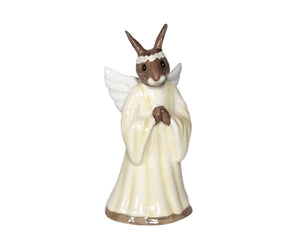 The bunny has white wings and is wearing a creamy coloured long gown plus a garland of white flowers with yellow centres.